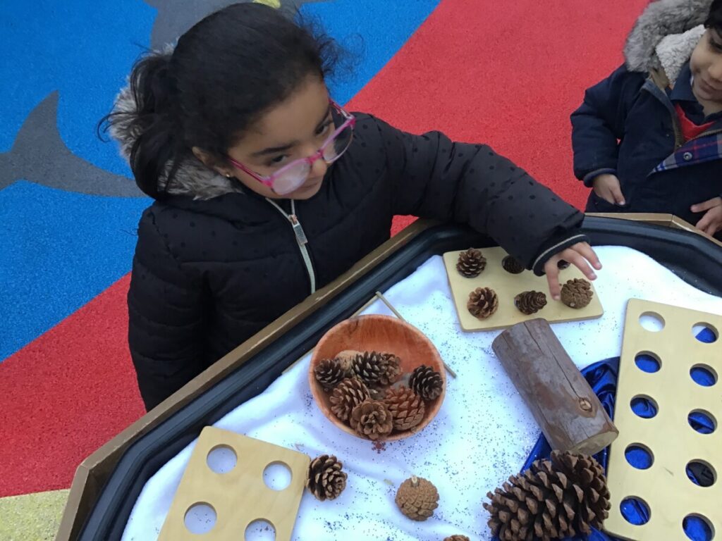Using Numicon Outside Today we have been counting natural resources using the numicon pieces ...