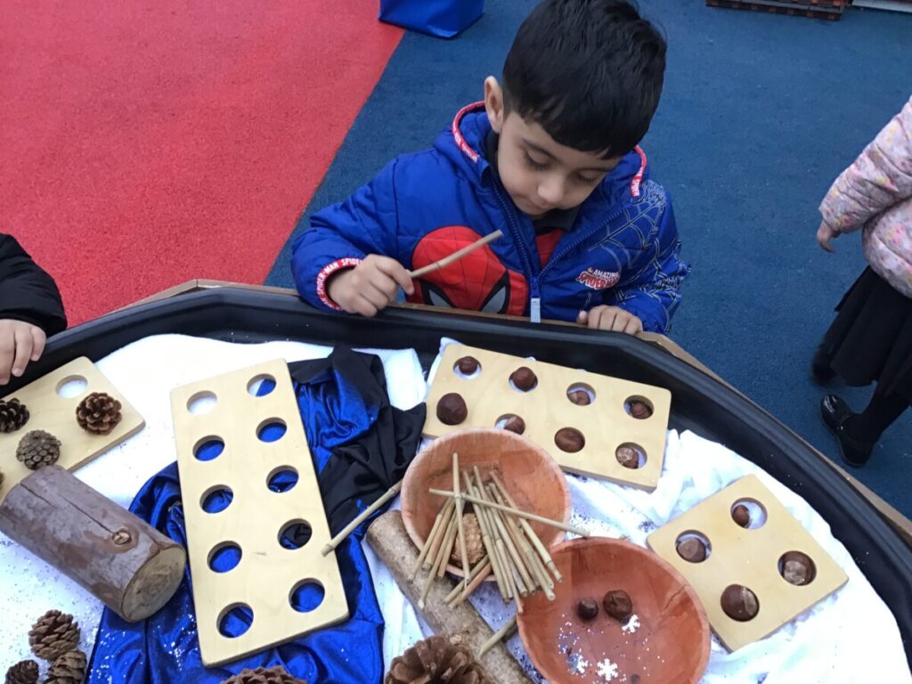 Using Numicon Outside Today we have been counting natural resources using the numicon pieces ...